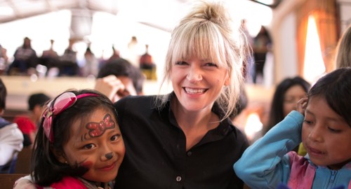 woman sitting with Compassion child