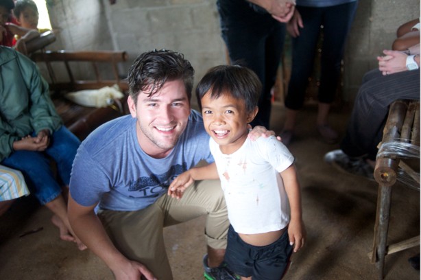 man with arm around child